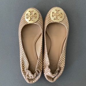 Gold Tory Burch flats.